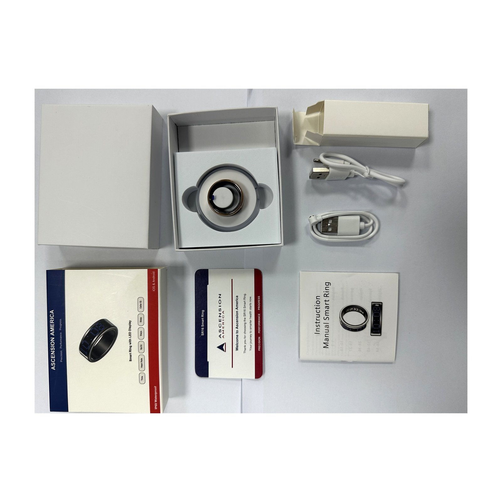SR16 smart ring unboxed with charging case and packaging contents